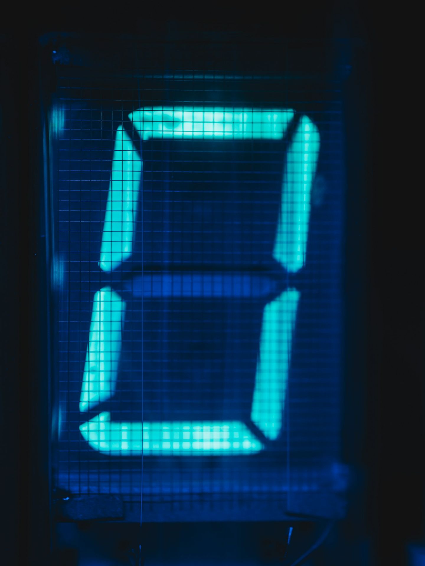 The number zero glows in blue light.